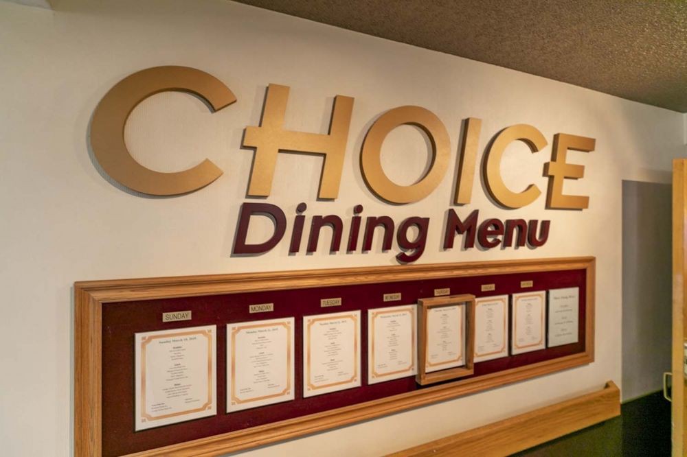 A dining menu display with various meal options, labeled 'CHOICE Dining Menu'.