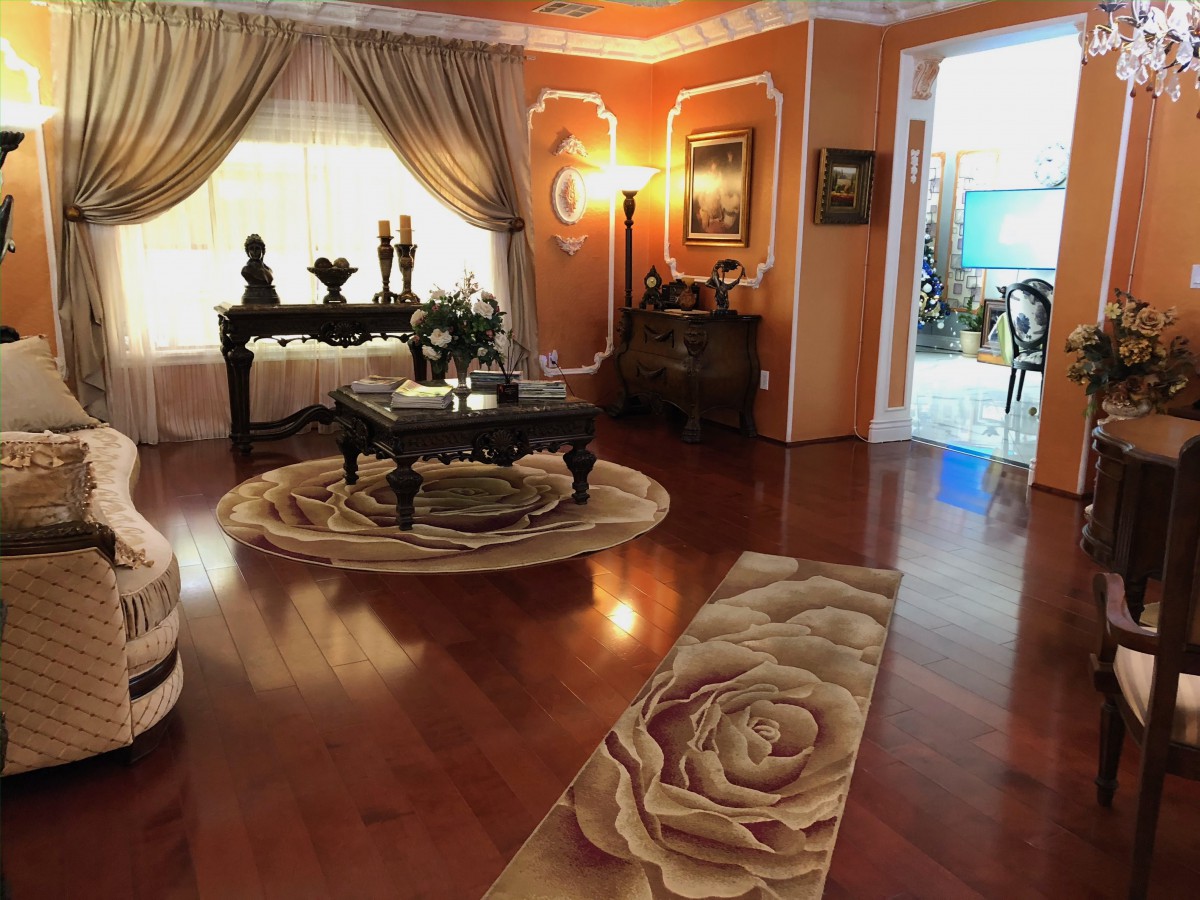 An elegantly decorated living room with traditional furnishings and a warm color palette.