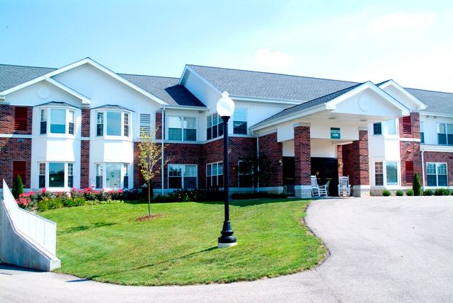 A suburban residential building with a well-maintained yard.