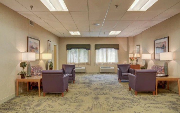 A spacious waiting room with comfortable seating and ample natural light.
