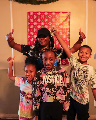 A joyful family moment captured during a festive celebration.