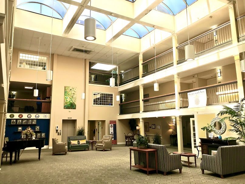 Spacious atrium lobby with skylights and comfortable seating.