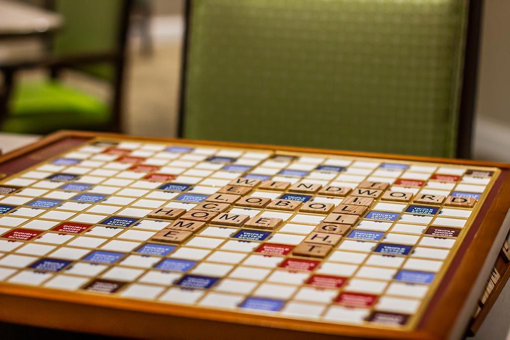 A Scrabble board with tiles placed for a game in progress.