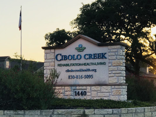 Cibolo Creek health services sign at sunset.