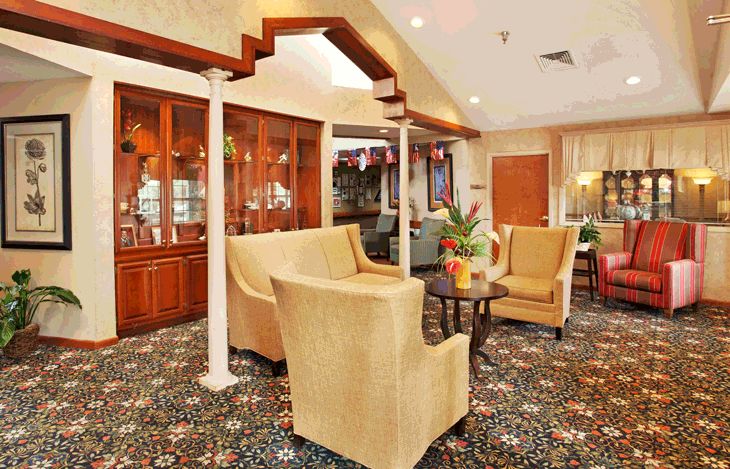 A cozy lounge area with comfortable seating and elegant decor.