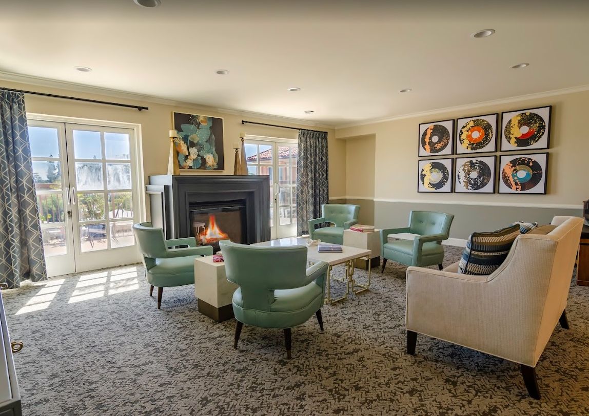 A cozy living room with a fireplace and stylish seating.