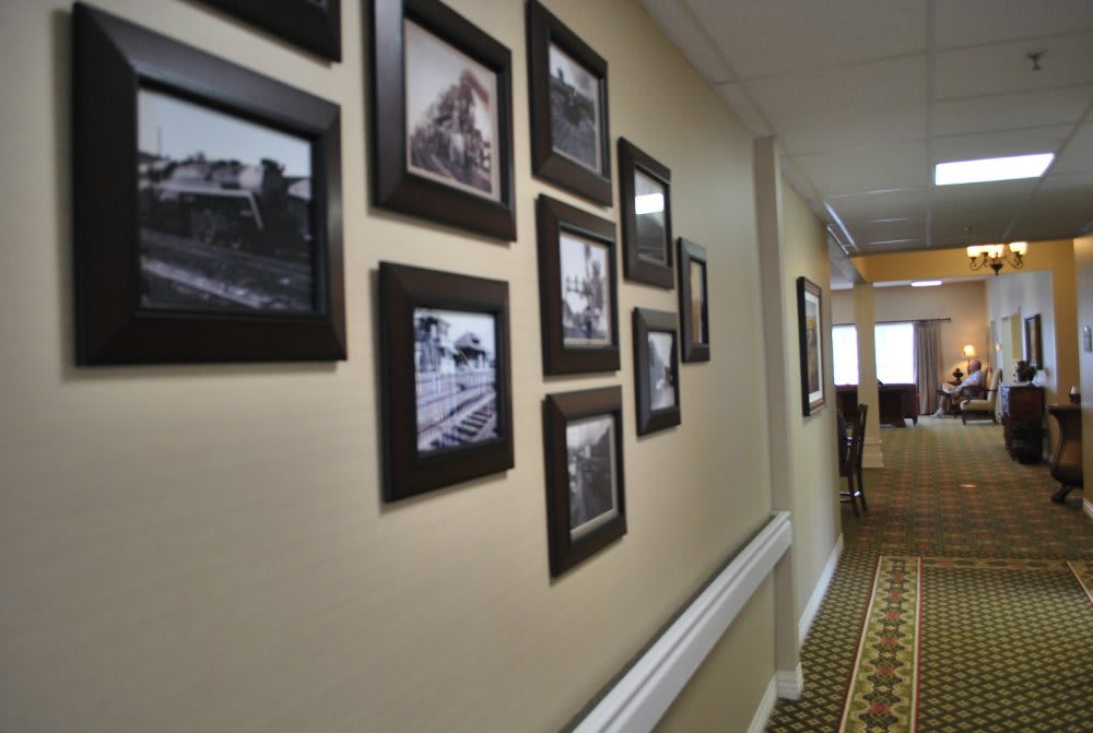 A hallway adorned with a collection of black and white framed photographs.