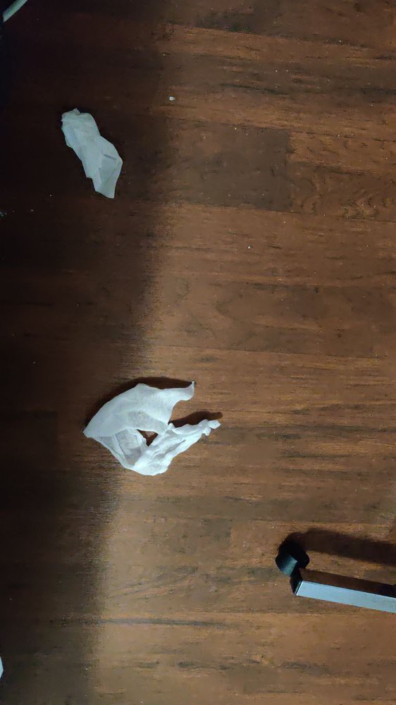 Crumpled paper on a wooden floor