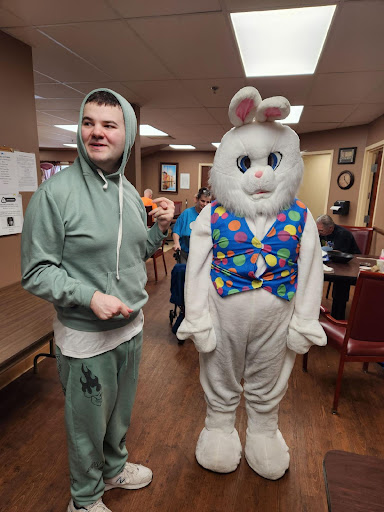 A fun Easter celebration featuring a person dressed as the Easter Bunny.