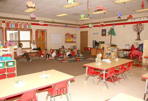 A lively classroom setting with children engaged in activities.