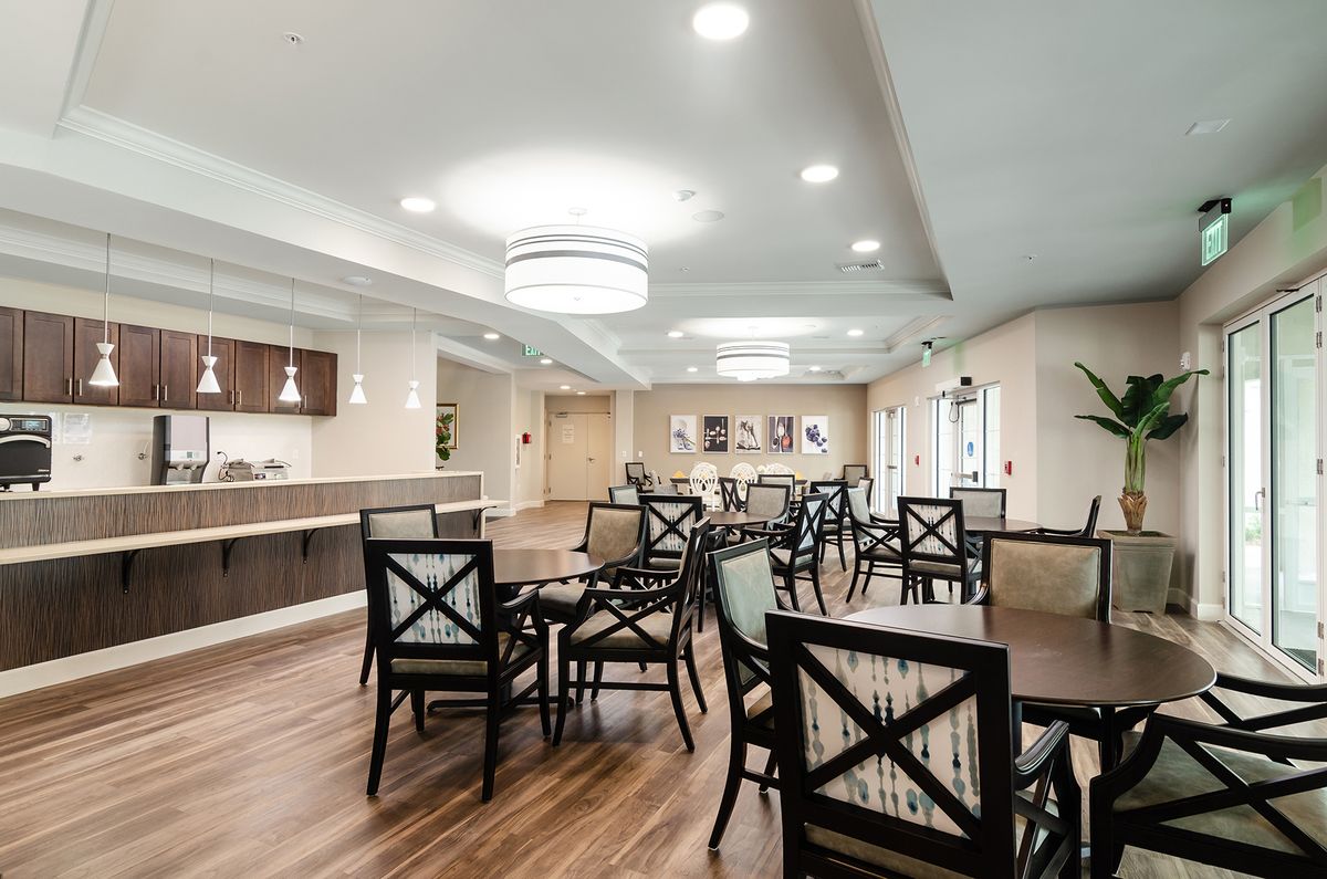 A modern dining area with elegant furnishings and ambient lighting.