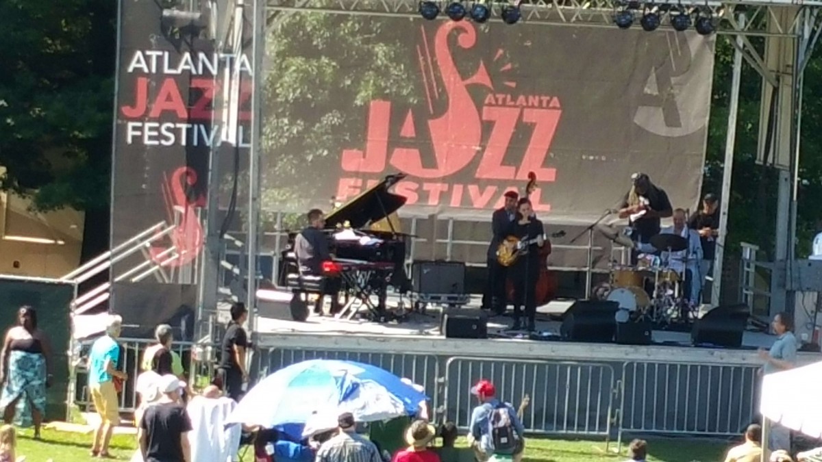 Musicians perform on stage at the Atlanta Jazz Festival.