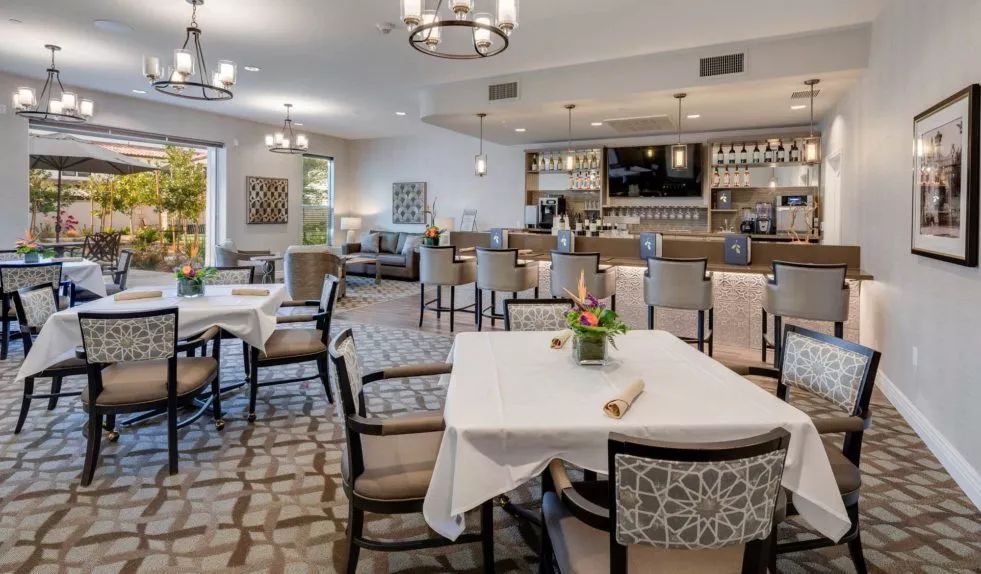 A well-appointed dining area with neatly arranged tables and elegant decor.