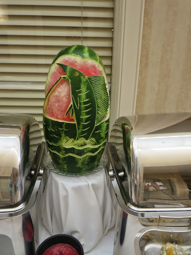 A beautifully carved watermelon centerpiece showcasing intricate designs.