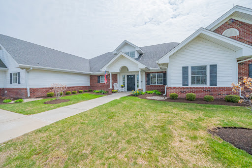 A charming residential home with well-maintained landscaping and a welcoming entrance.