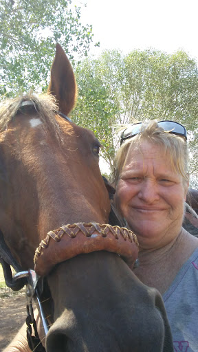 A joyful moment shared between a person and a horse.