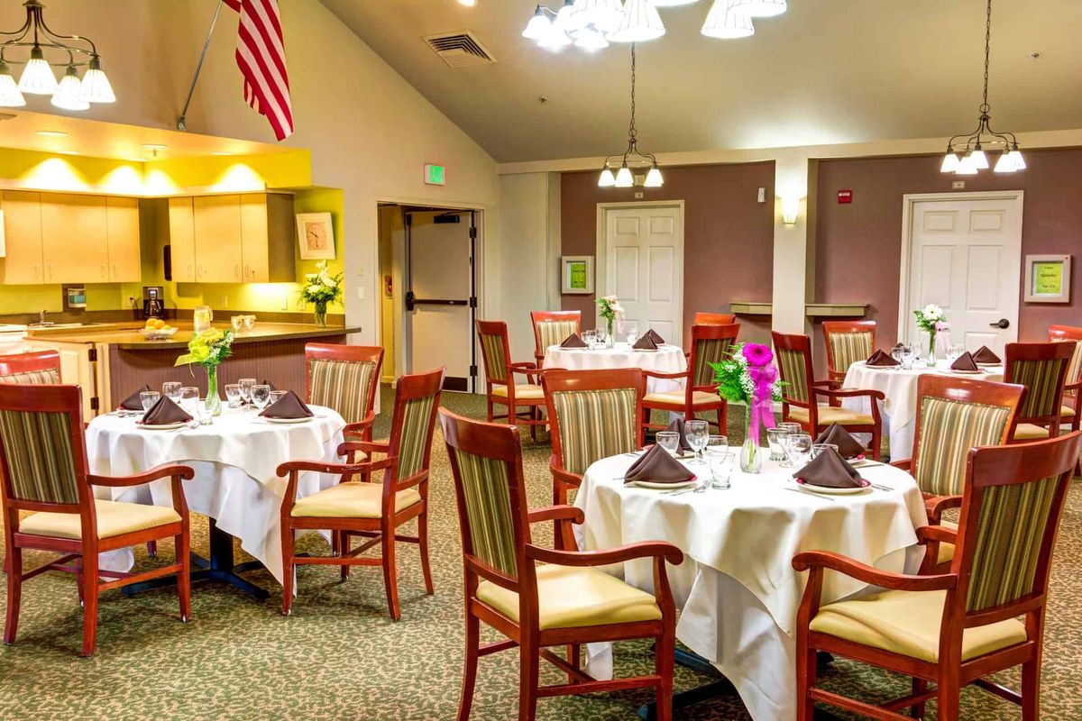 A well-arranged dining room with tables set for guests.
