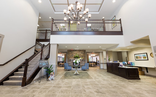 A beautifully designed lobby featuring an elegant chandelier and welcoming decor.