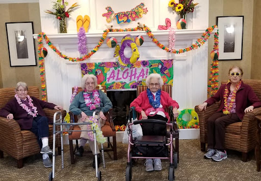 Residents enjoying a festive Aloha celebration together.