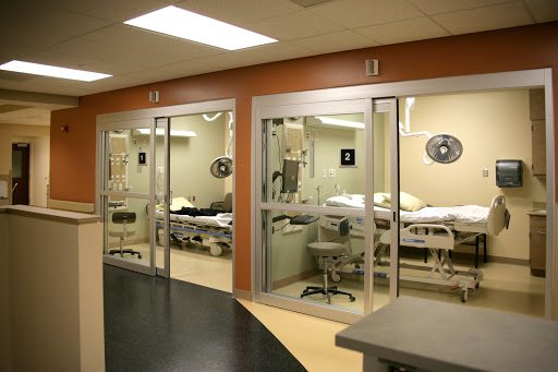 A view of patient rooms in a modern hospital setting.