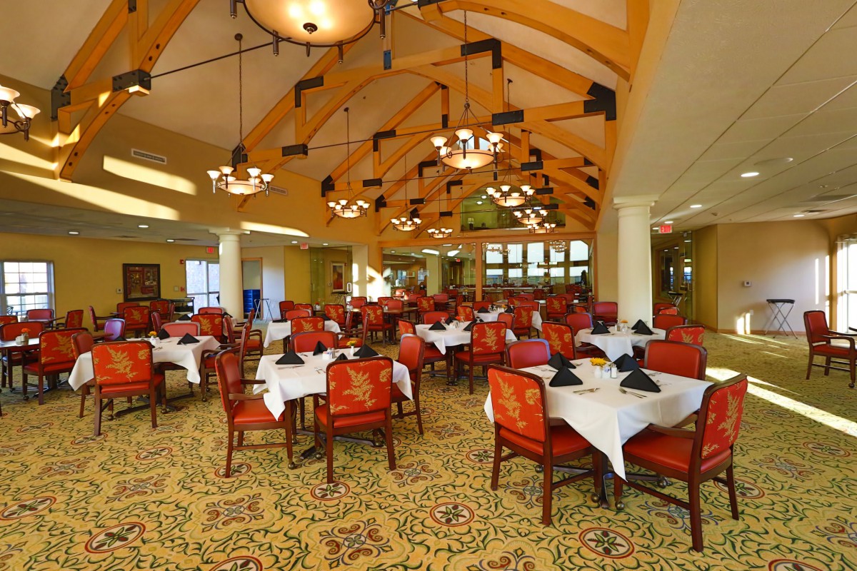 An elegant restaurant dining area with neatly set tables and stylish decor.