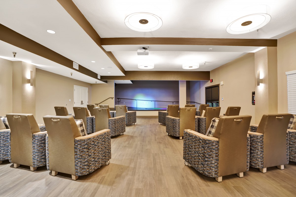 A modern lounge with comfortable seating and stylish lighting.
