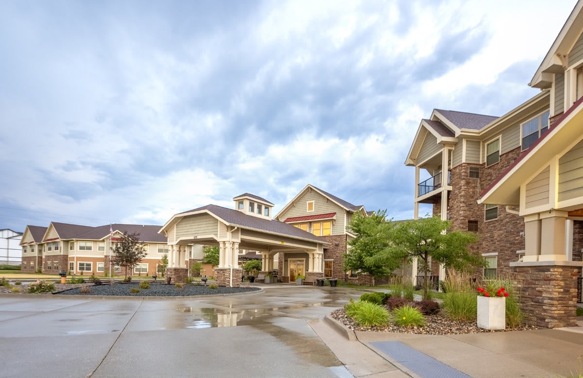 A suburban residential building under a cloudy sky.