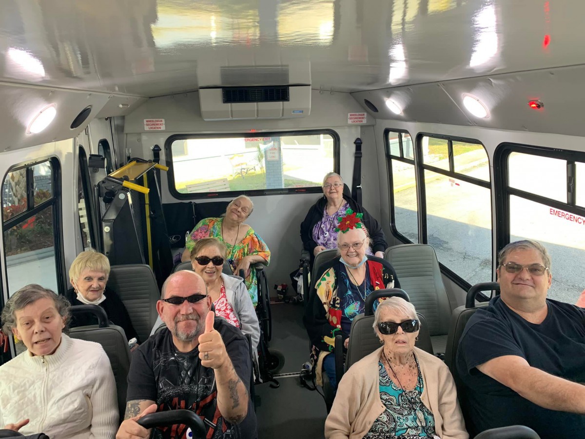 A group of people enjoying a bus ride.