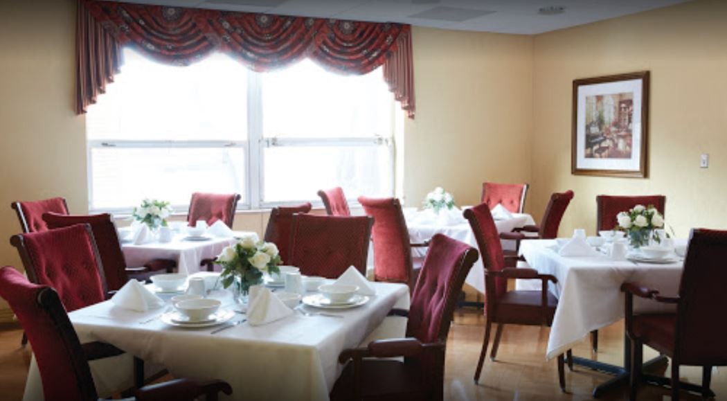 A well-arranged dining area with tables set for guests.