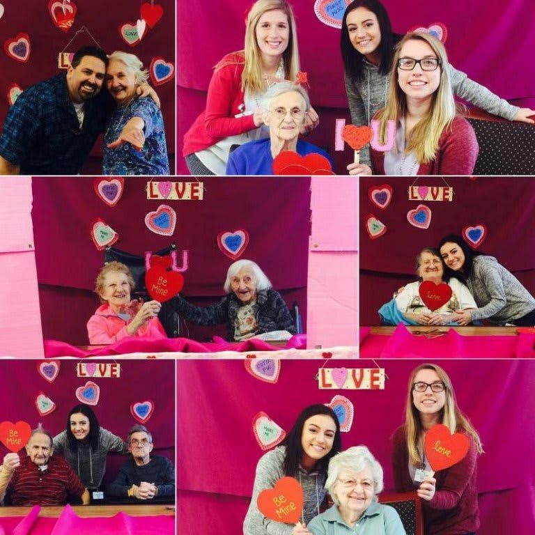 Families celebrating Valentine's Day with smiles and hearts.
