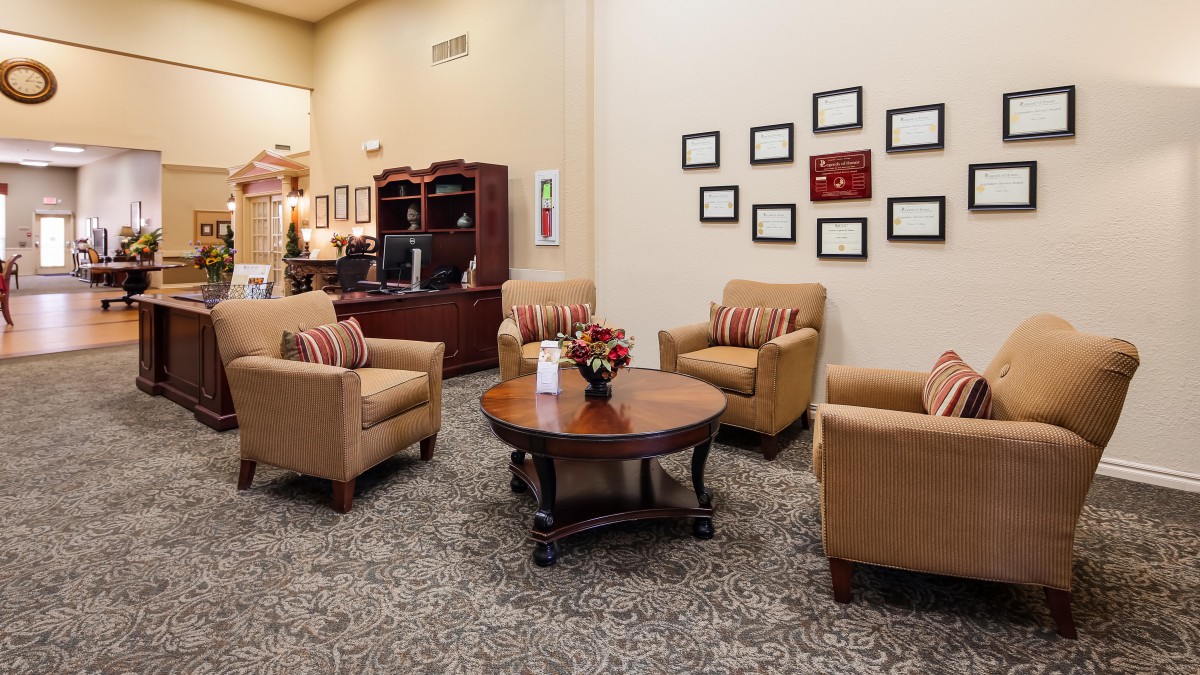A cozy waiting room with comfortable seating and elegant decor.