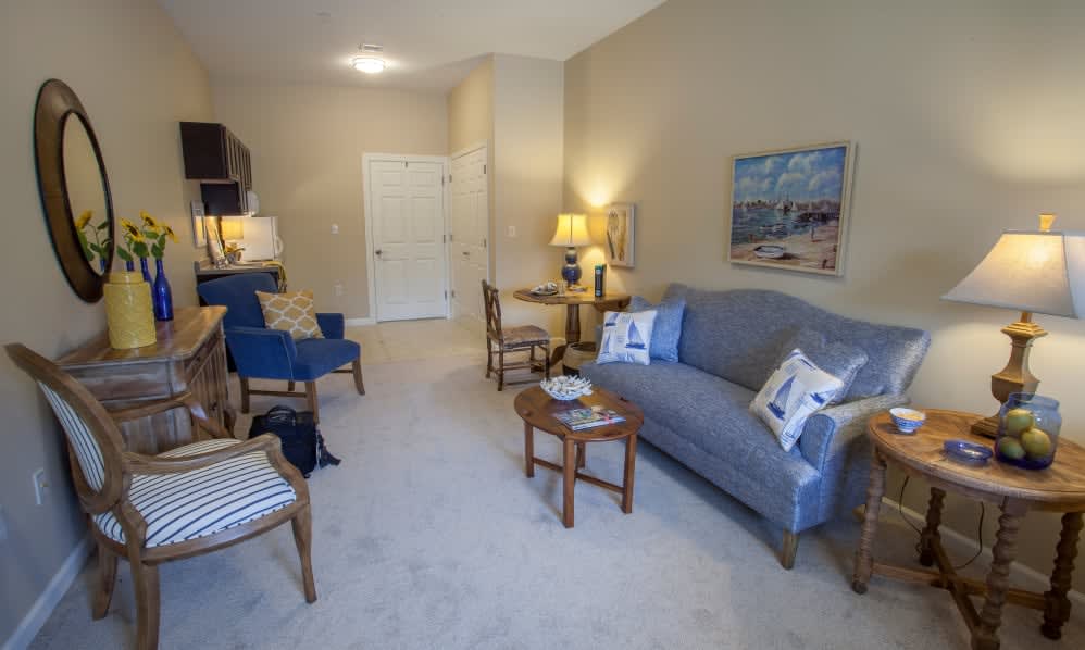 A cozy living room with comfortable seating and warm lighting.