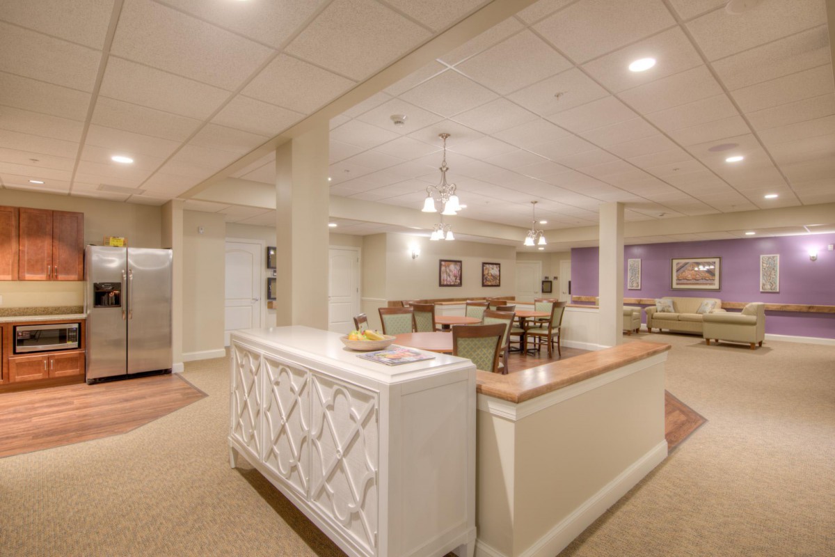 A cozy basement area with furniture and soft lighting.