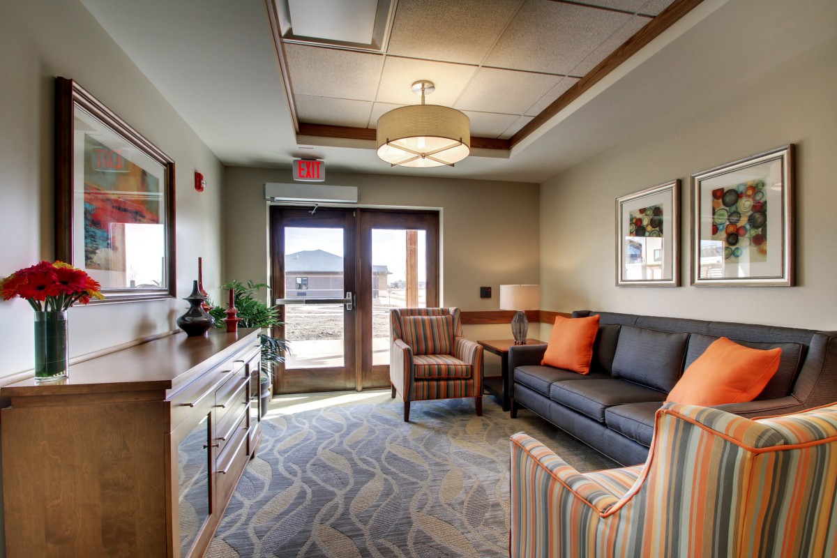 A cozy and well-decorated living room featuring a comfortable sofa, armchairs, and stylish decor.