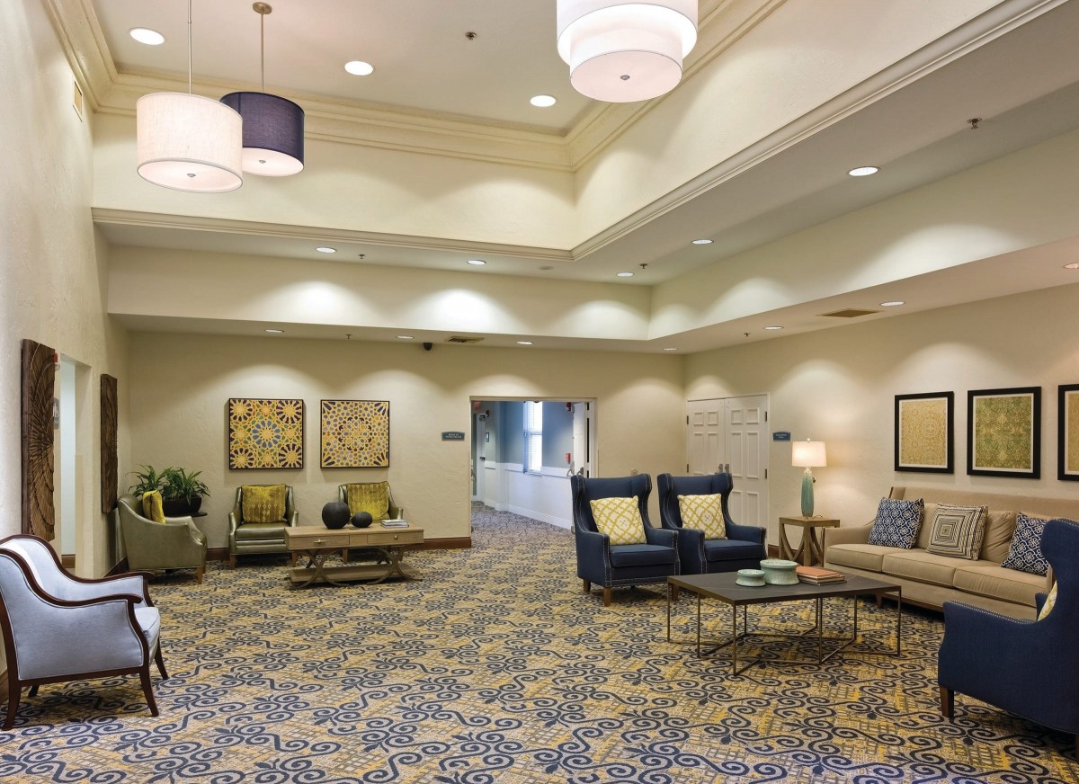 A spacious and elegantly decorated lobby with comfortable seating and modern lighting.