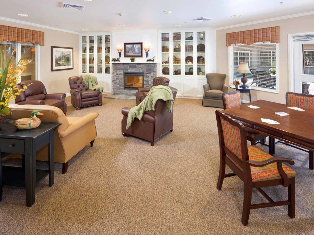 A cozy living room with comfortable seating and a fireplace.