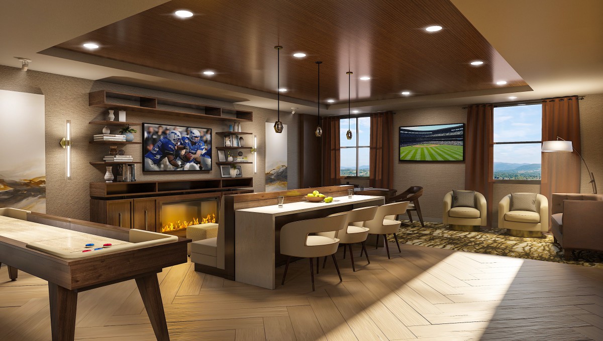 A luxurious and modern open living space featuring a kitchen island, bar, seating area, and large television.