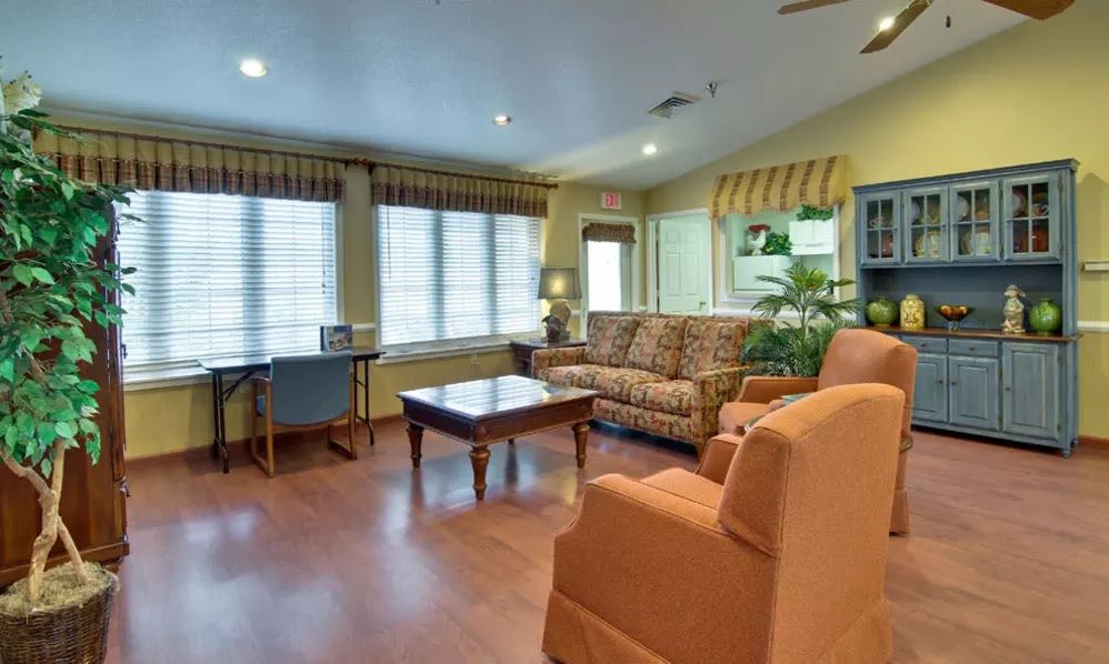 A cozy living room with comfortable seating and a warm ambiance.