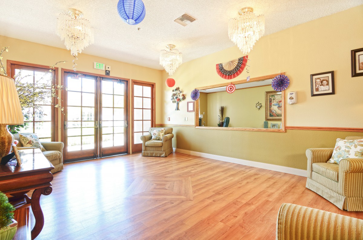 A welcoming reception area with colorful decorations and a wooden floor.