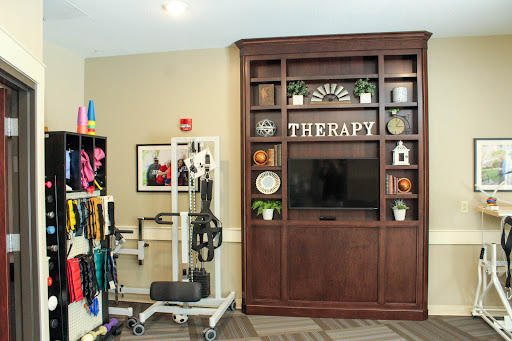 A therapy room equipped with exercise tools and a welcoming interior.