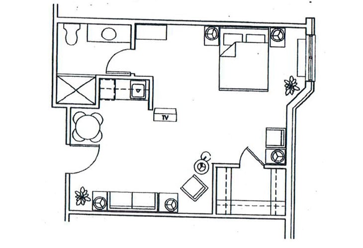 A floor plan of an apartment featuring a bedroom, living room, kitchen, and bathroom.