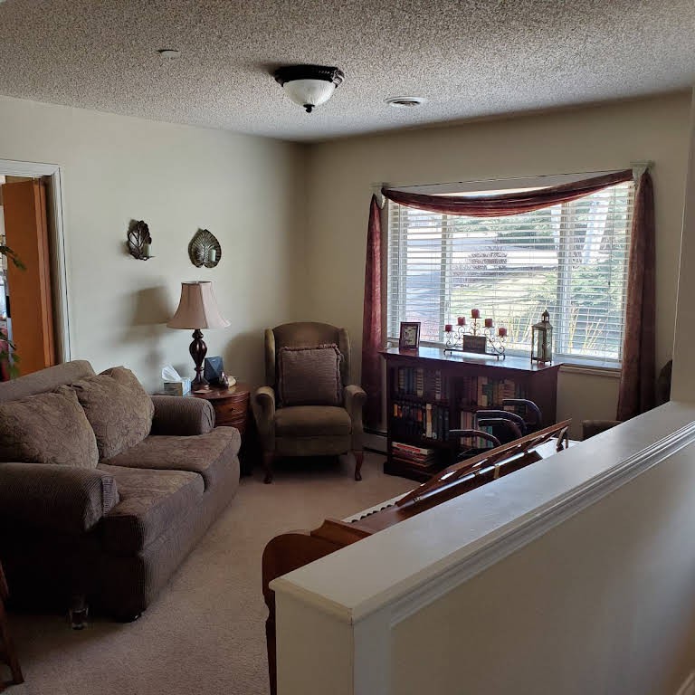 A cozy living room with comfortable seating and natural light.