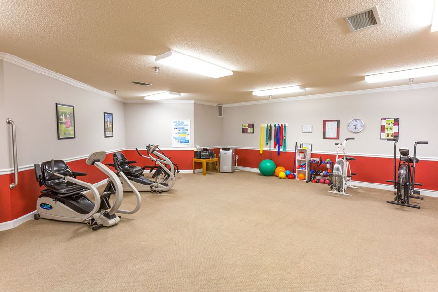 A well-equipped exercise room featuring stationary bikes and fitness accessories.