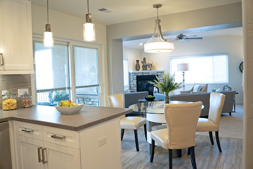 A contemporary kitchen and dining area featuring sleek furniture and a bright, inviting atmosphere.