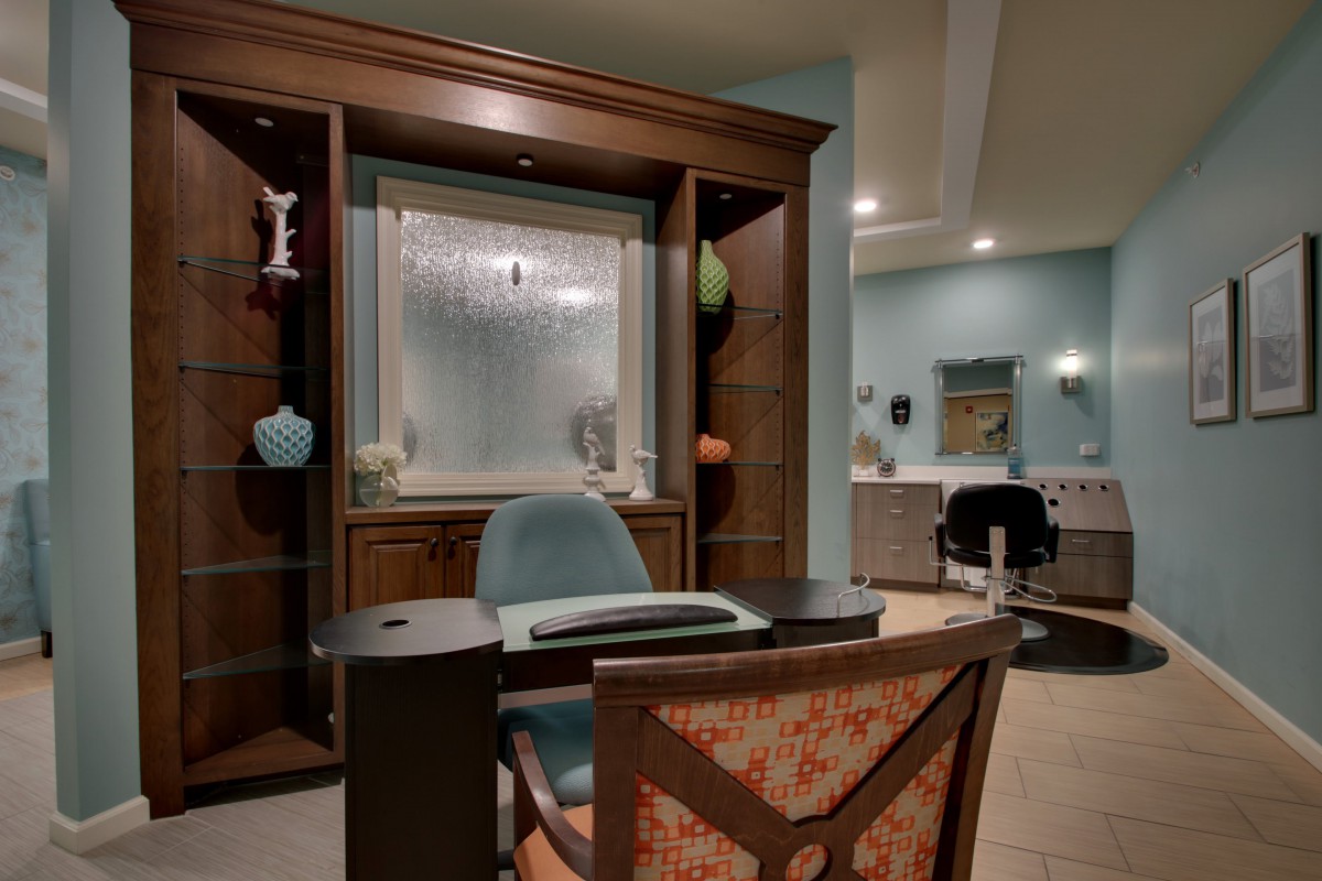 A modern office interior with a desk and chair setup.