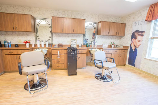 A well-organized hair salon featuring modern barber chairs and ample storage.