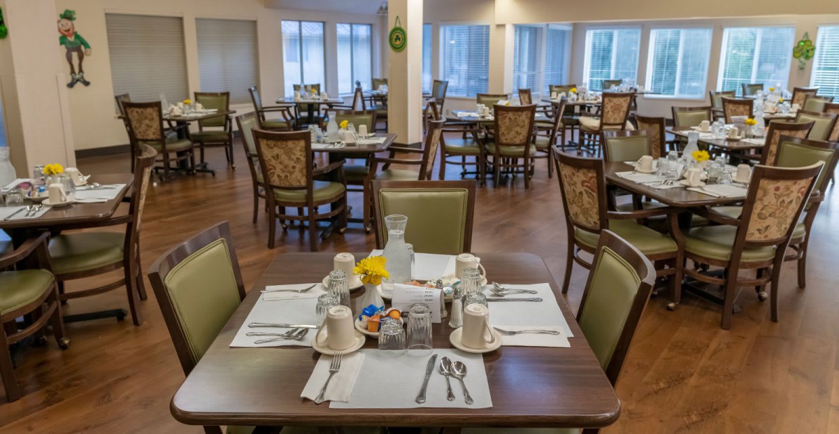 An elegant dining room with neatly set tables ready for guests.