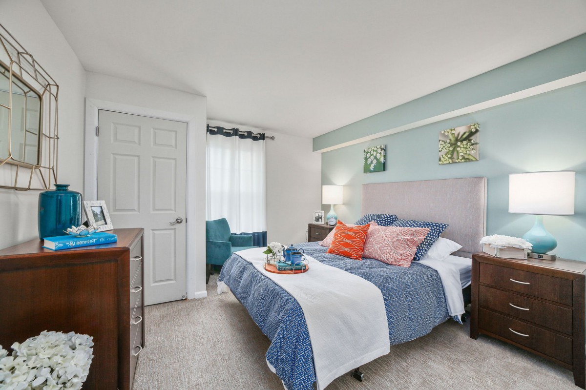 A cozy and modern bedroom with stylish decor and furnishings.