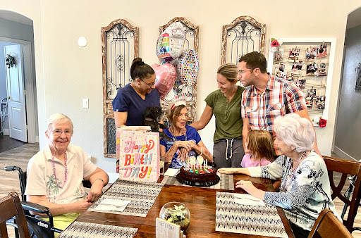 A warm family gathering to celebrate a special birthday with cake and laughter.
