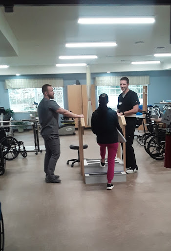 A physical therapy session in progress, focusing on patient rehabilitation.